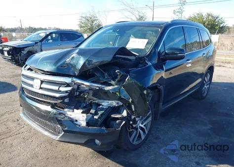 2017 Honda Pilot Touring z USA, uszkodzony, nr VIN 5FNYF5H90HB034244